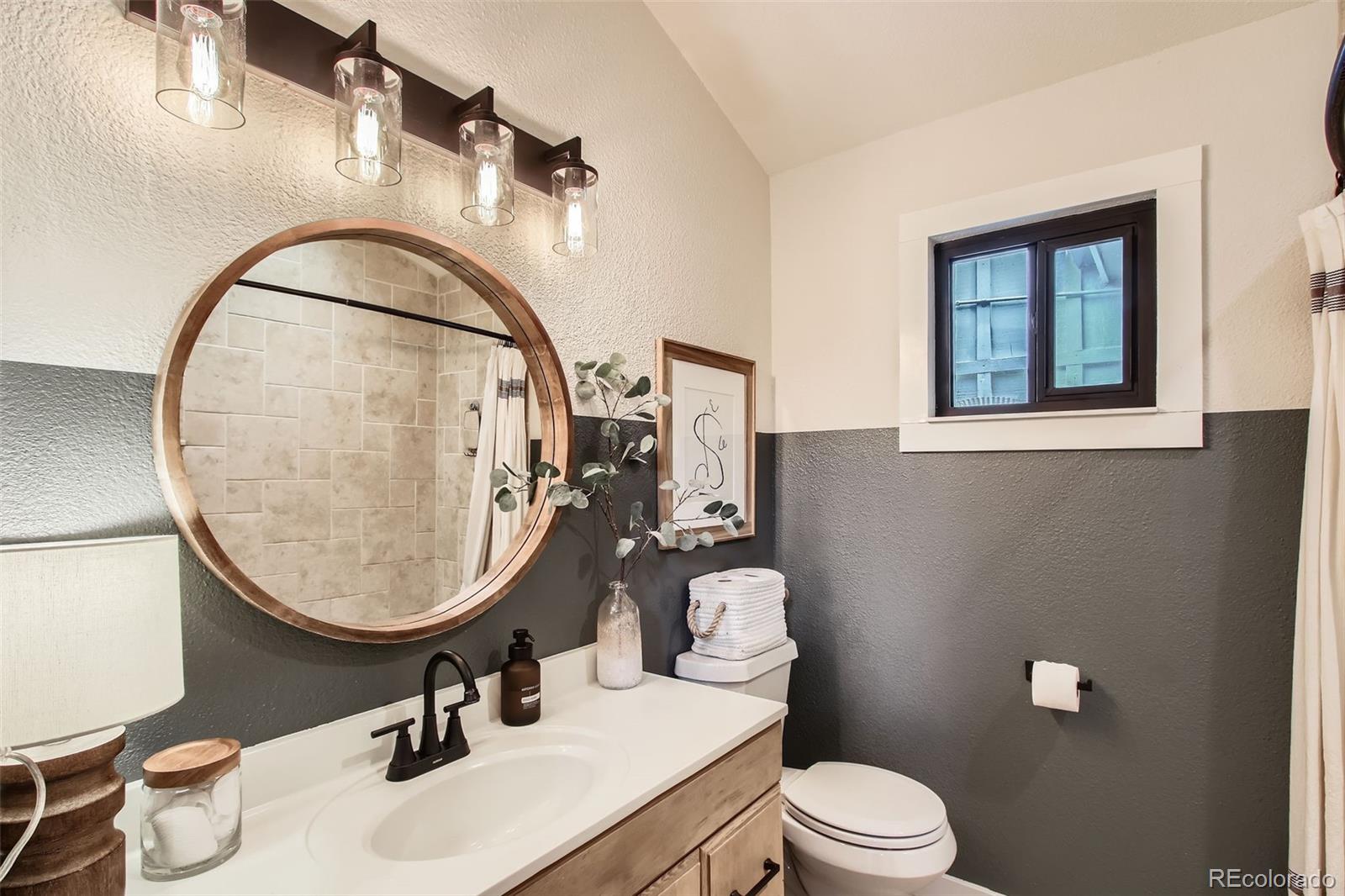 16626 Ouray Road West Pine, CO 80470 - Photo 12 of 50 a bathroom with a sink a toilet and a mirror
