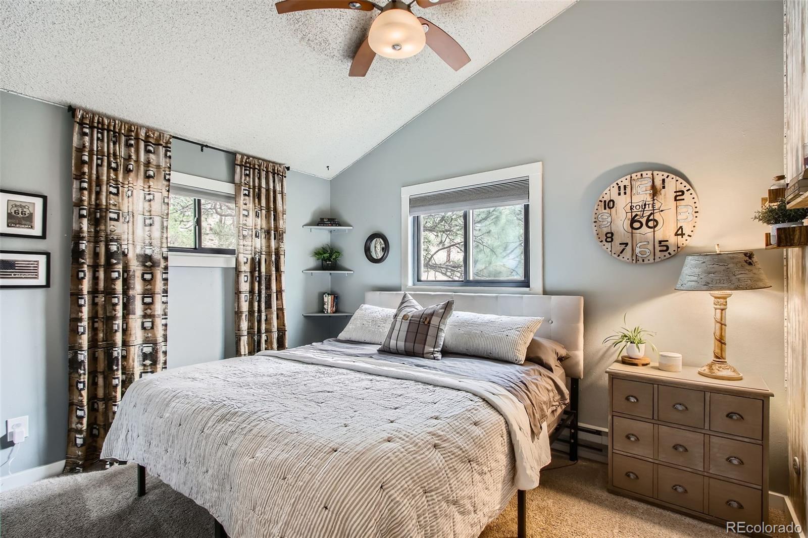 16626 Ouray Road West Pine, CO 80470 - Photo 13 of 50 a bedroom with a bed and a chandelier