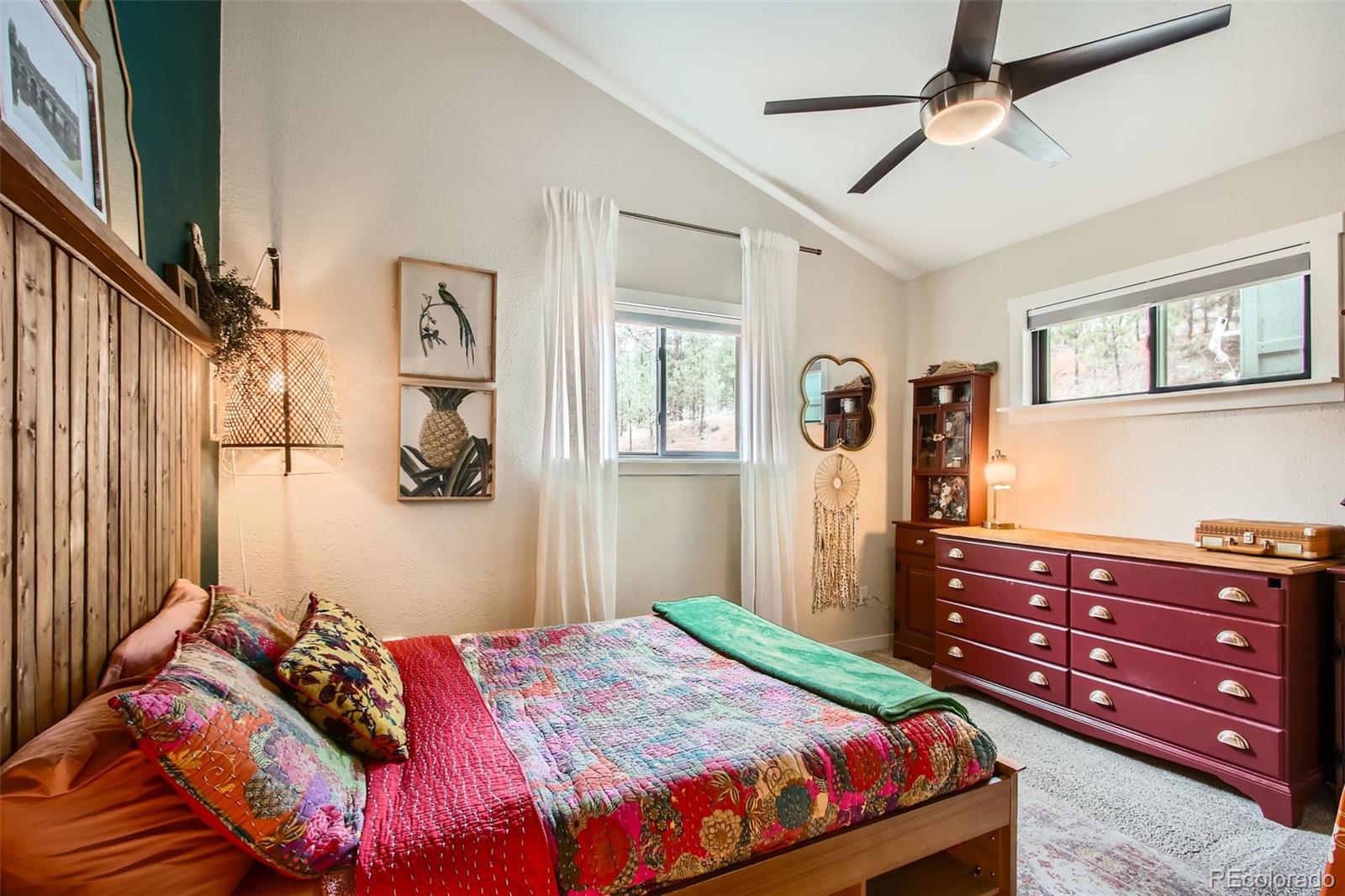16626 Ouray Road West Pine, CO 80470 - Photo 14 of 50 a bedroom with a bed and a dresser
