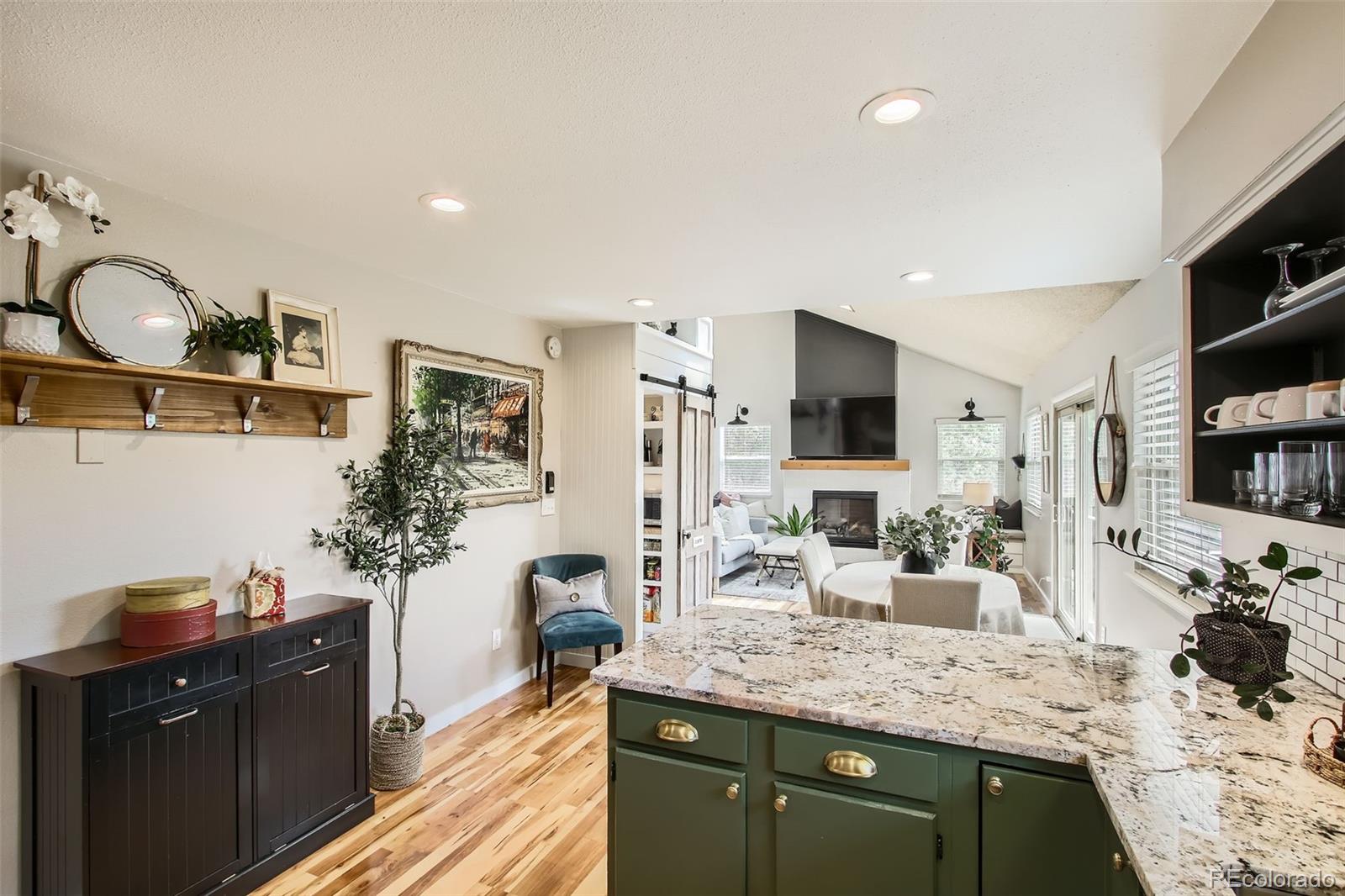 16626 Ouray Road West Pine, CO 80470 - Photo 2 of 50 a kitchen with granite countertop a sink and a stove