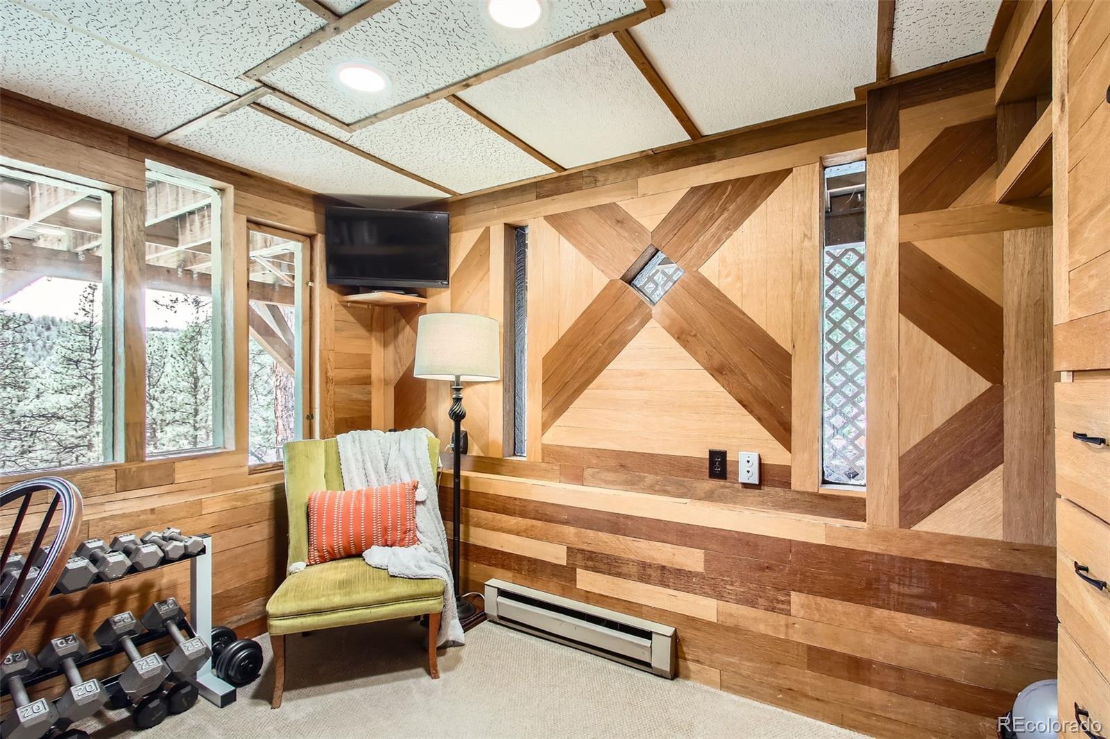 16626 Ouray Road West Pine, CO 80470 - Photo 23 of 50 a bedroom with furniture and a window