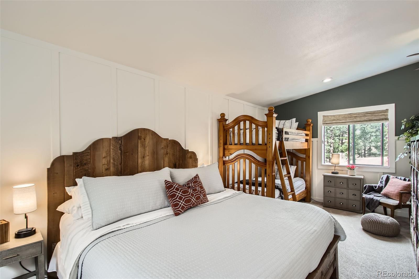 16626 Ouray Road West Pine, CO 80470 - Photo 33 of 50 a bed room with a bed and a chair