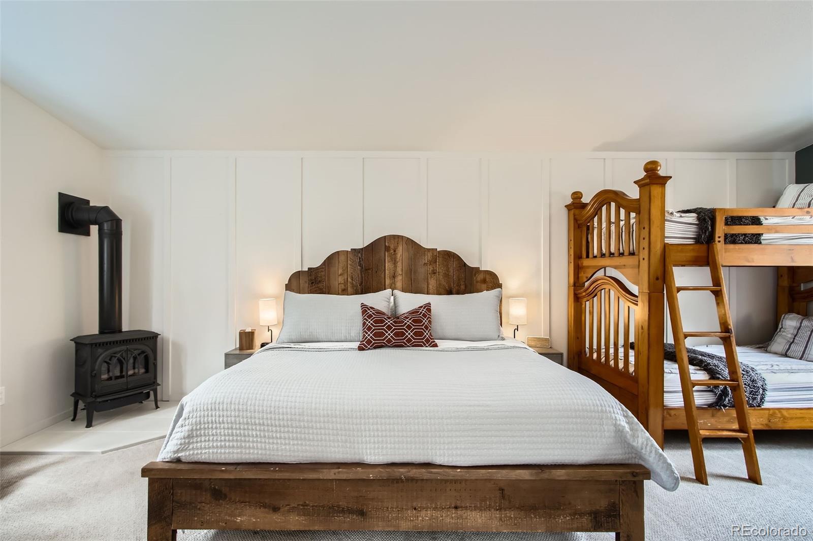 16626 Ouray Road West Pine, CO 80470 - Photo 34 of 50 a bedroom with a bed and wooden floor