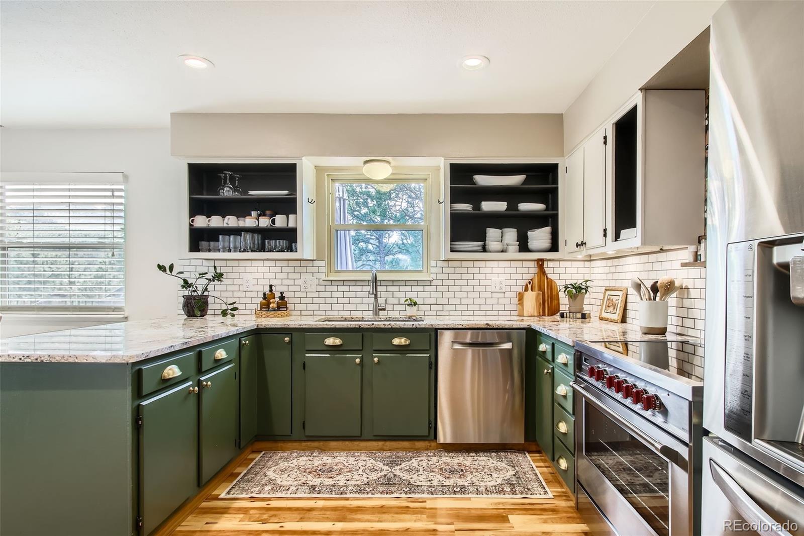 16626 Ouray Road West Pine, CO 80470 - Photo 8 of 50 a kitchen with a sink stove and cabinets