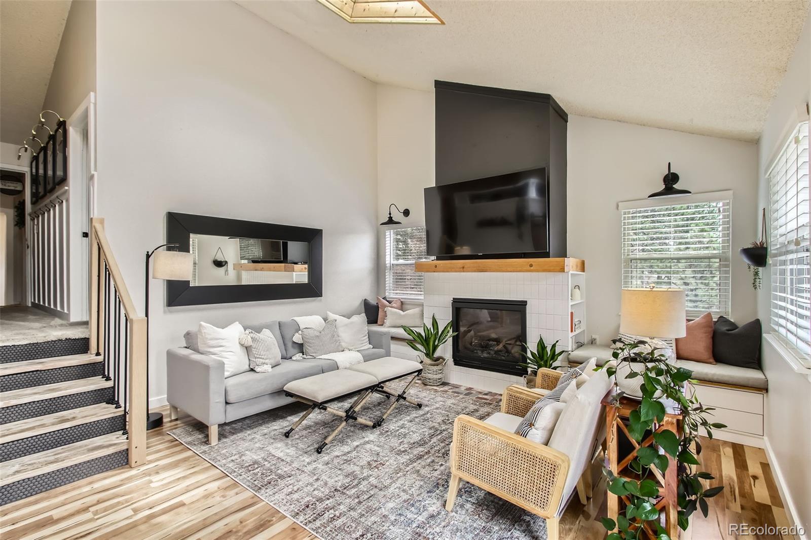 16626 Ouray Road West Pine, CO 80470 - Photo 9 of 50 a living room with furniture a fireplace and a flat screen tv