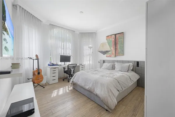 a bedroom with a bed and a couch