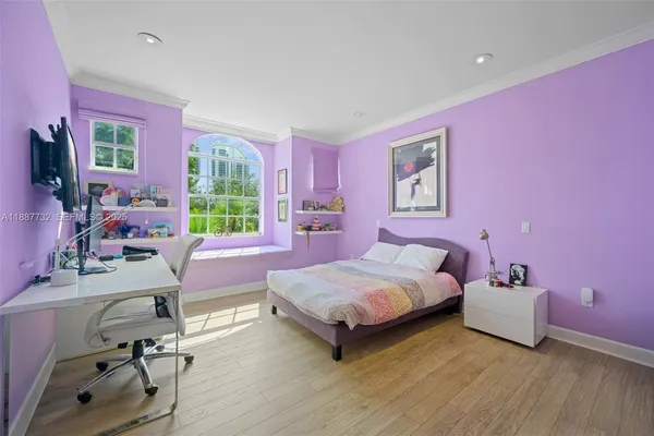 a bedroom with a bed and a desk
