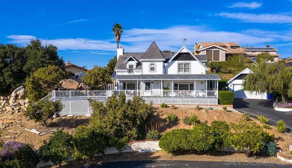 2444 Crestview Estates Place Escondido, CA 92027 - Photo 22 of 25 a front view of a house with a yard