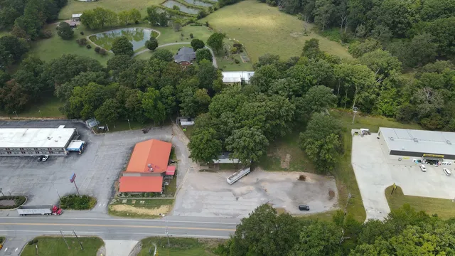 an aerial view of a house with outdoor space