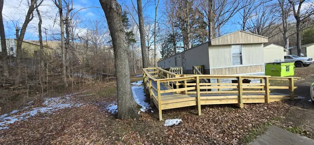 a view of yard covered with snow in front of house