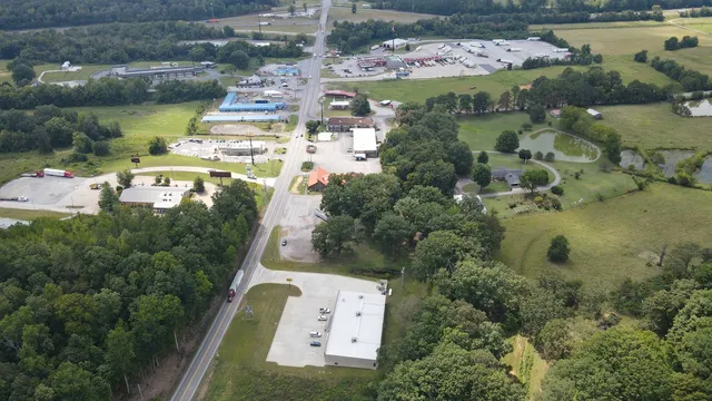 an aerial view of residential houses with outdoor space