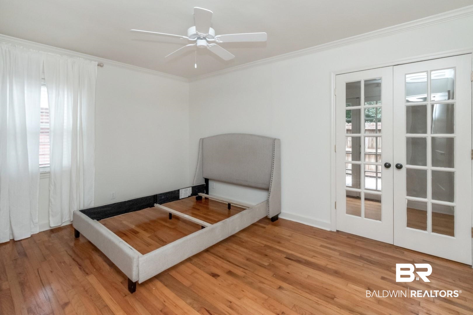 1906 Old Shell Road Mobile, AL 36607 - Photo 22 of 26 Bedroom featuring light hardwood / wood-style floors, multiple windows, and french doors