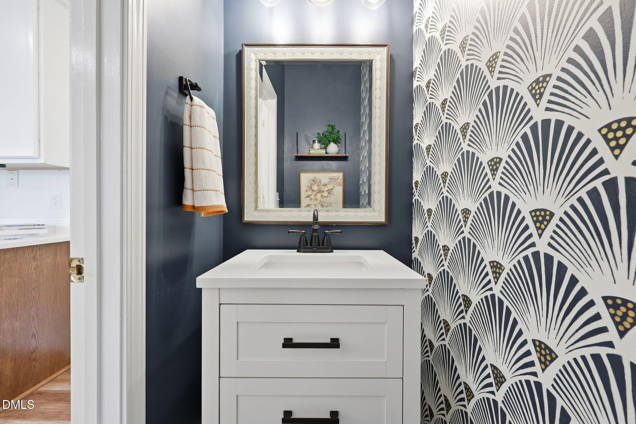 5629 Enoree Lane Raleigh, NC 27616 - Photo 17 of 38 a bathroom with a sink and a mirror