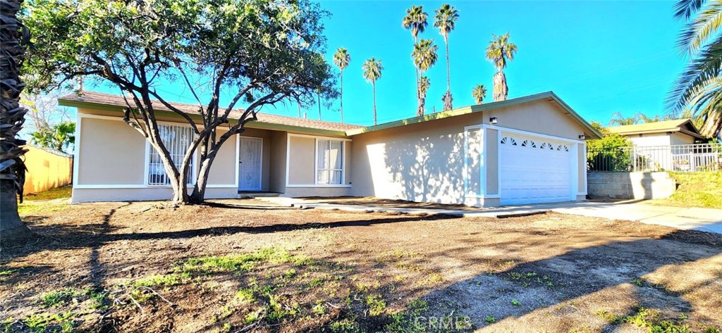 919 Geronimo Road Perris, CA 92570 - Photo 1 of 1 a front view of a house with a yard