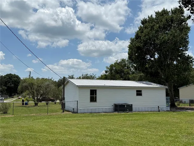 a view of a backyard of the house