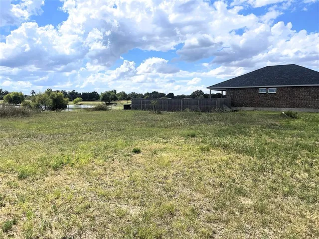 a view of a lake with a big yard