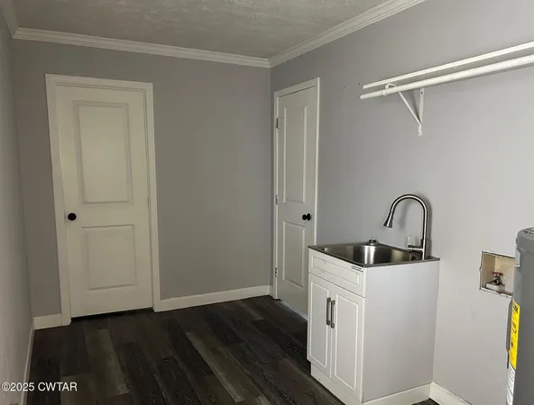 a kitchen with a sink and cabinets