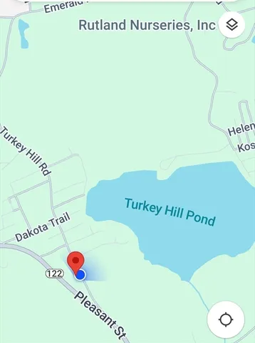 a view of a kitchen with a microwave and a table