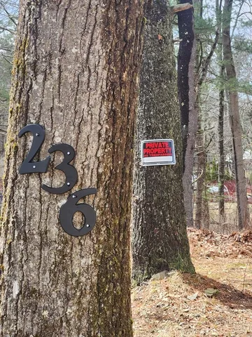 a sign that is on the side of a road