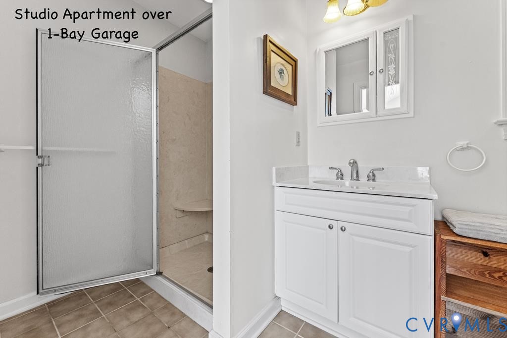 2414 Windmill Point Road White Stone, VA 22578 - Photo 57 of 72 a bathroom with a sink mirror and vanity