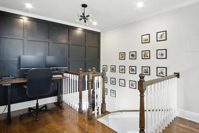 a view of a livingroom with a dinning area hardwood floor and staircase