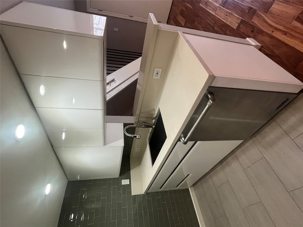 3110 Red River Street, Unit 216 Austin, TX 78705 - Photo 13 of 22 a kitchen with a sink and a refrigerator