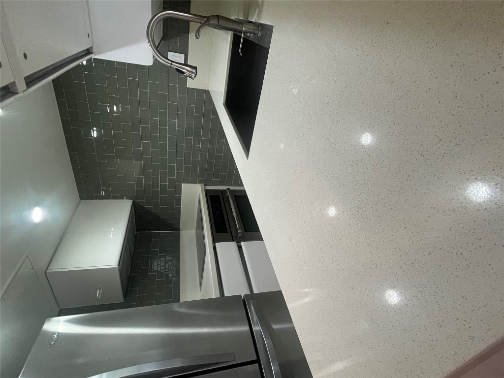 3110 Red River Street, Unit 216 Austin, TX 78705 - Photo 15 of 22 a bathroom with a sink a toilet and a mirror