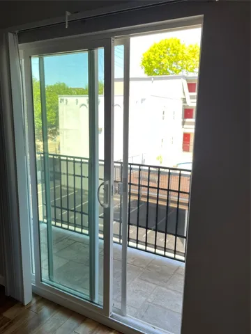 a view of a glass door with a outdoor space