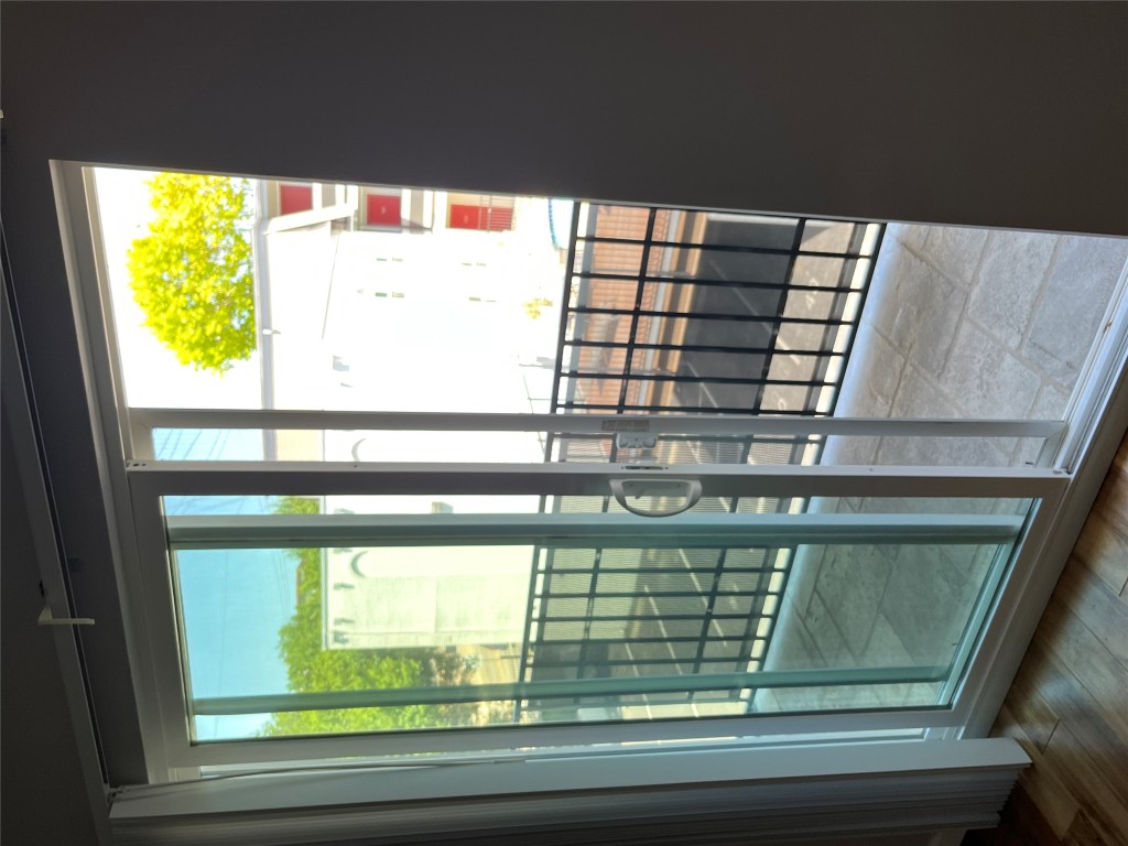 3110 Red River Street, Unit 216 Austin, TX 78705 - Photo 21 of 22 a view of a glass door with a outdoor space