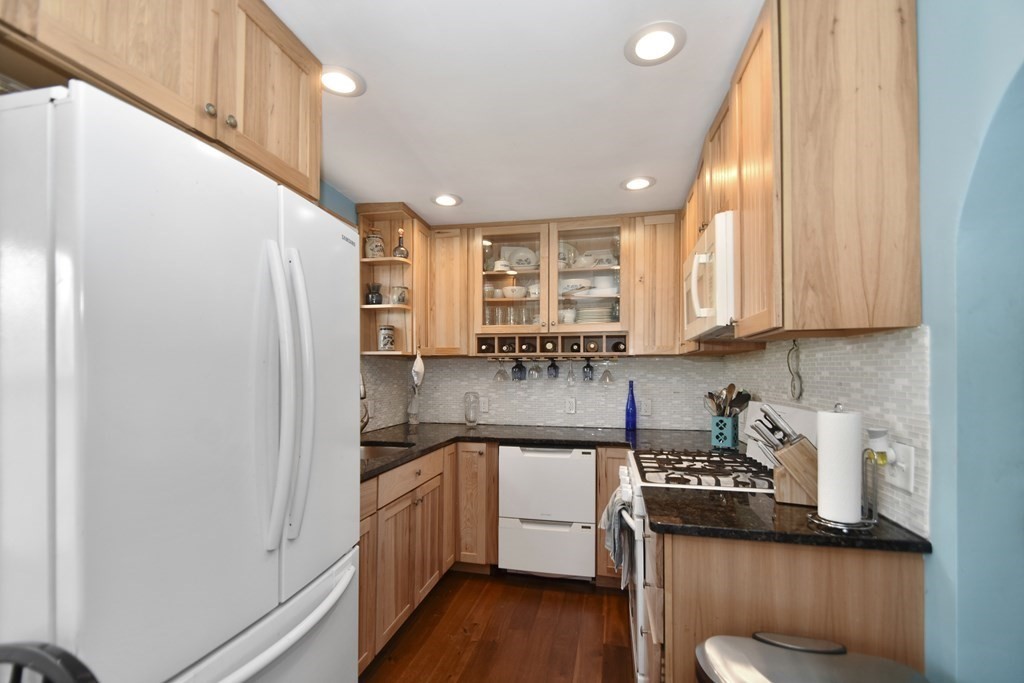 15 Madison Street Boston, MA 02136 - Photo 13 of 28 a kitchen with stainless steel appliances granite countertop a sink a stove and a refrigerator
