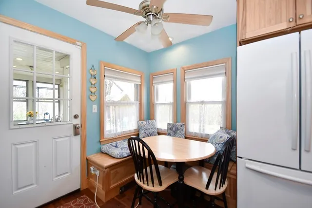 a view of a dining room with furniture window and outside view