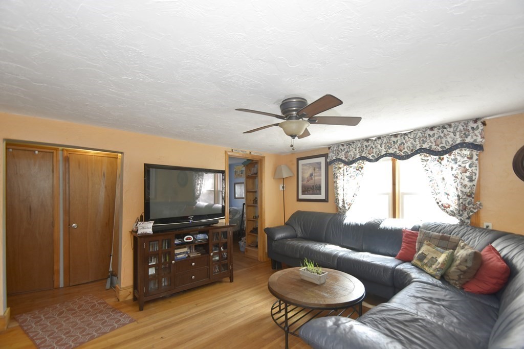 15 Madison Street Boston, MA 02136 - Photo 17 of 28 a living room with furniture and a flat screen tv