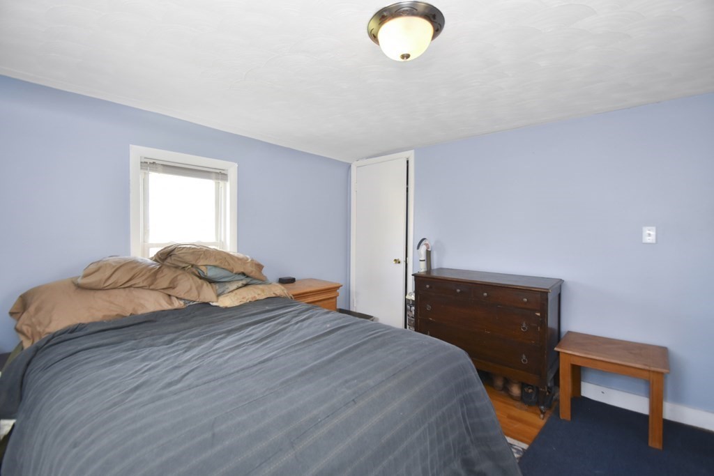 15 Madison Street Boston, MA 02136 - Photo 28 of 28 a bedroom with a bed and window