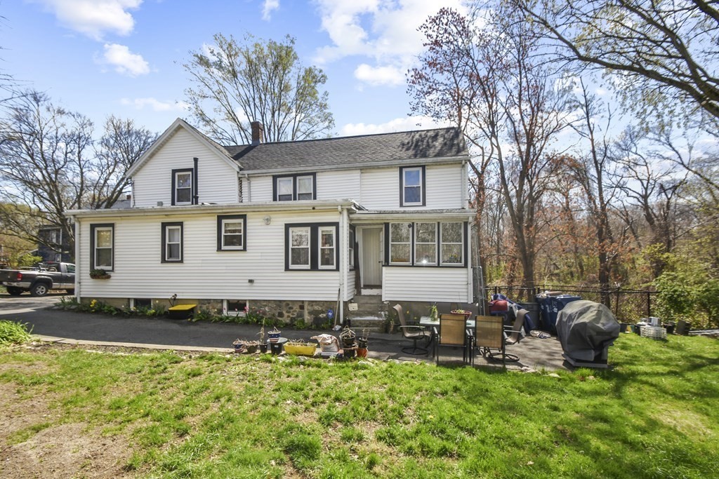 15 Madison Street Boston, MA 02136 - Photo 4 of 28 a front view of a house with a yard