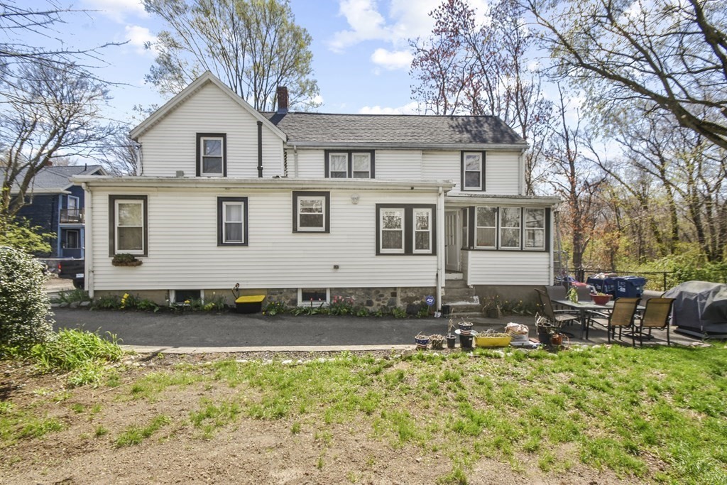 15 Madison Street Boston, MA 02136 - Photo 5 of 28 a front view of a house with garden
