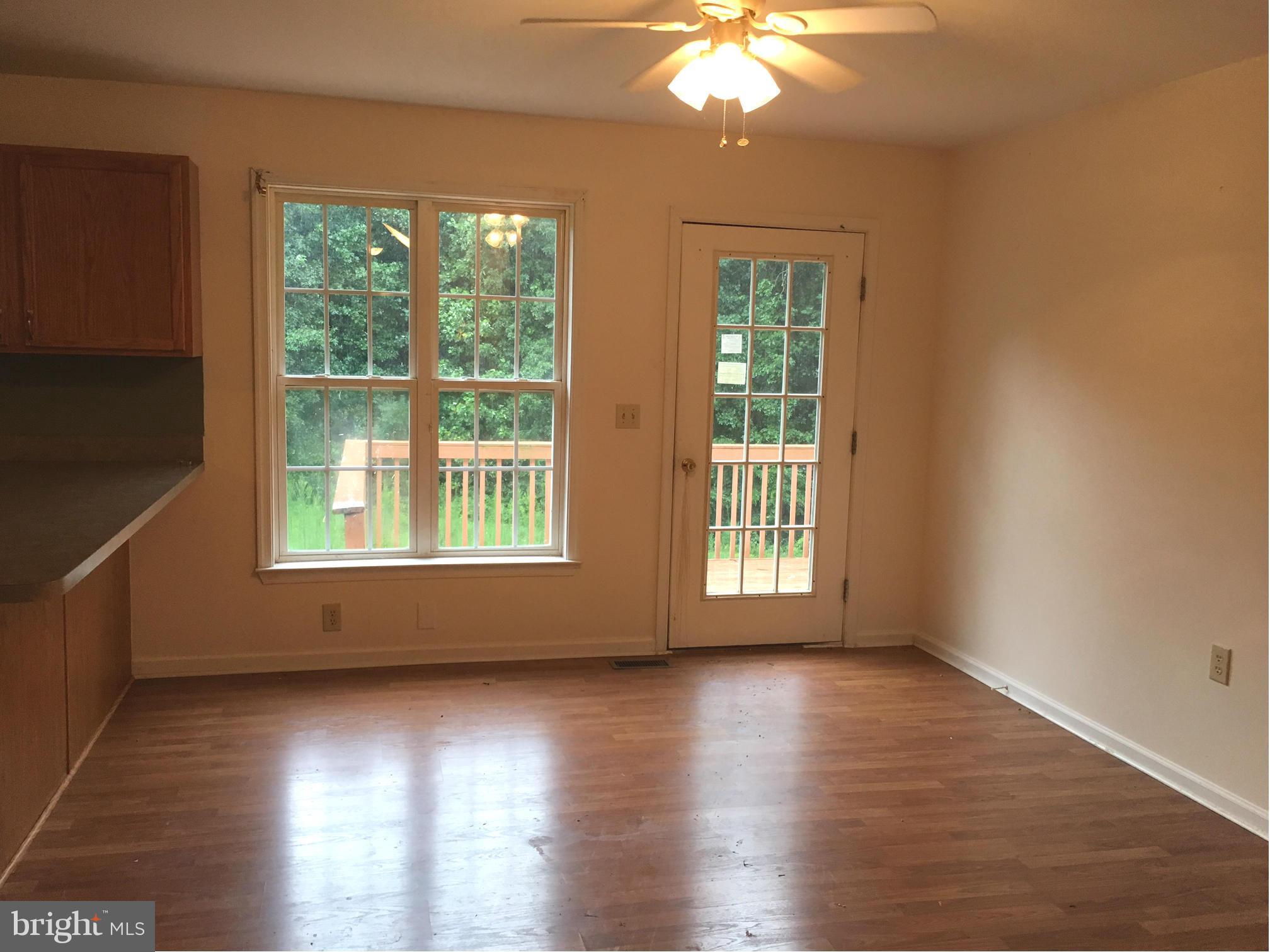 Open concept dining and kitchen w/deck access