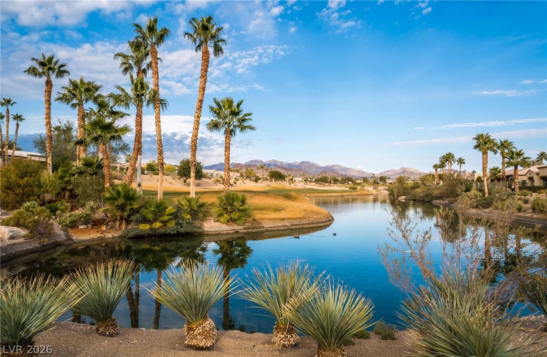5389 Progresso Street Las Vegas, NV 89135 - Photo 35 of 41 Scenic water views complement a lush golf course and vibrant landscaping.