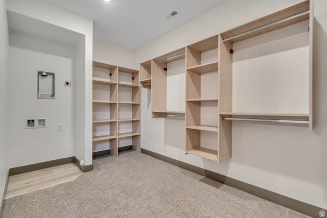 3317 South 1000 West, Unit 6010 Logan, UT 84321 - Photo 10 of 34 Walk in closet featuring light carpet