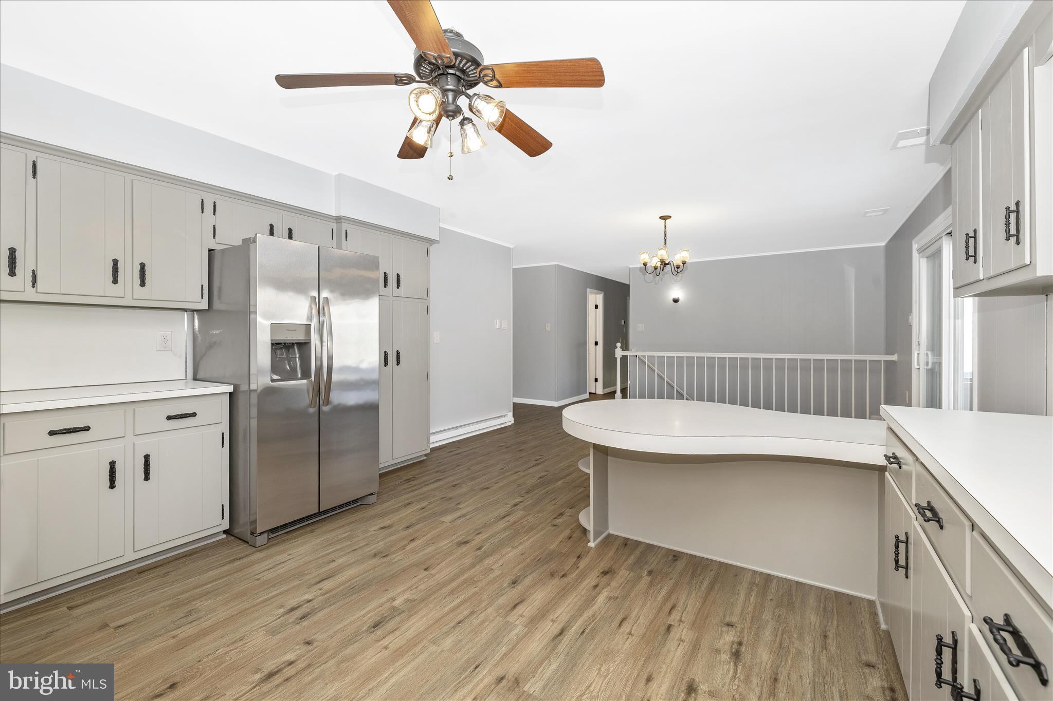 2640 Jefferson Pike Jefferson, MD 21755 - Photo 15 of 63 a kitchen with white cabinets and stainless steel appliances