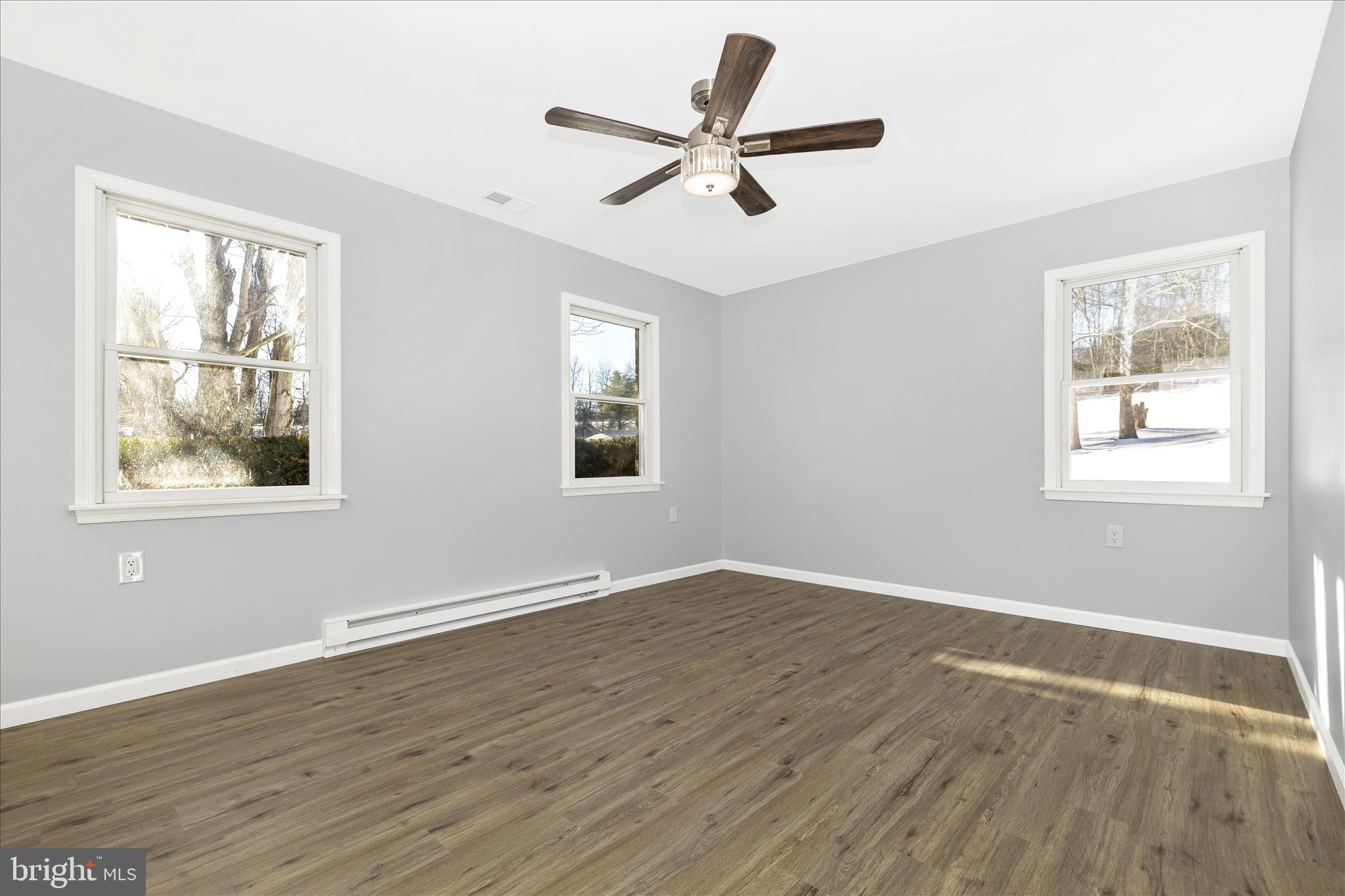 2640 Jefferson Pike Jefferson, MD 21755 - Photo 16 of 63 a view of an empty room with wooden floor and a window