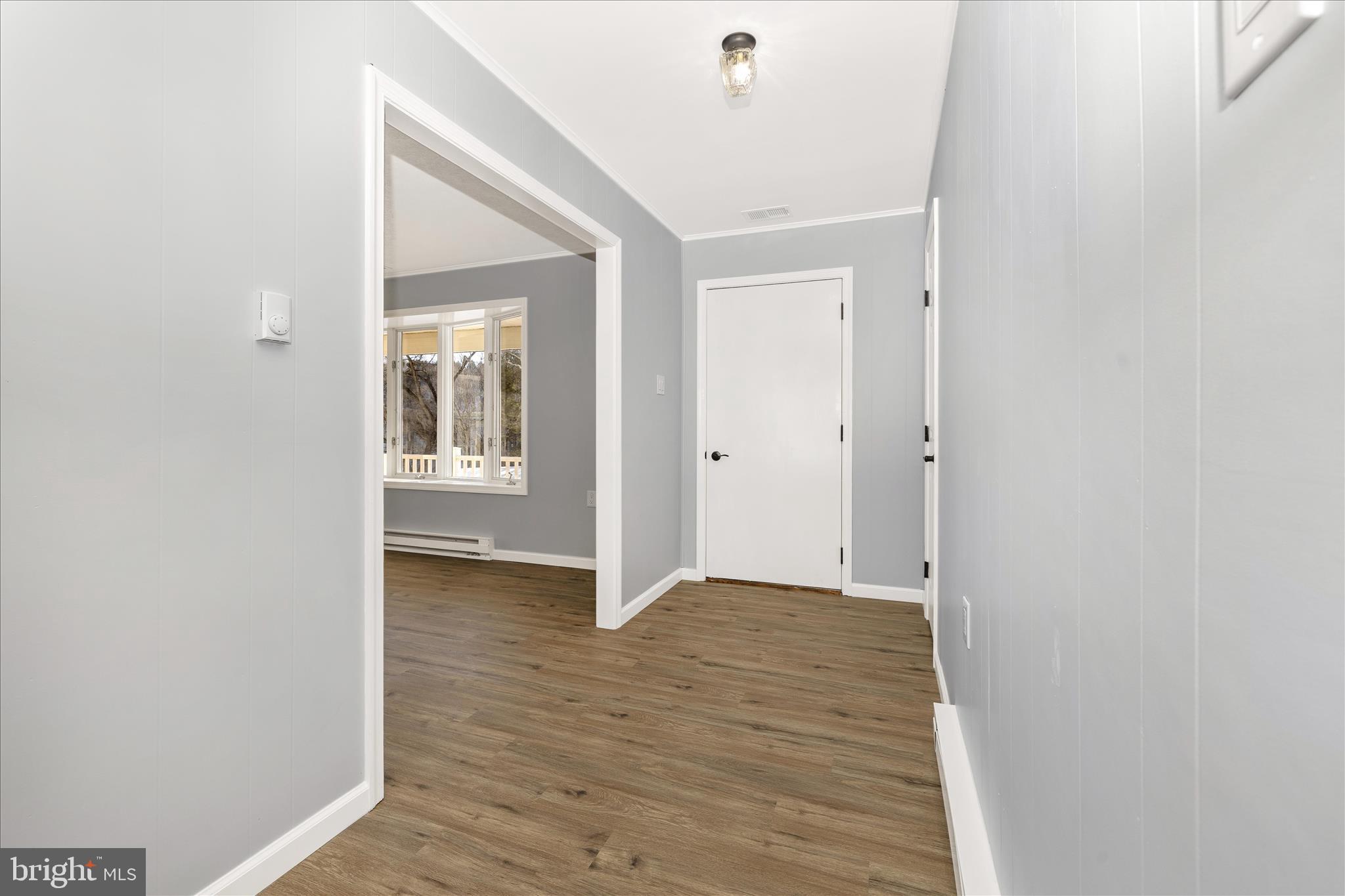 2640 Jefferson Pike Jefferson, MD 21755 - Photo 2 of 63 a view of an empty room with wooden floor and a window