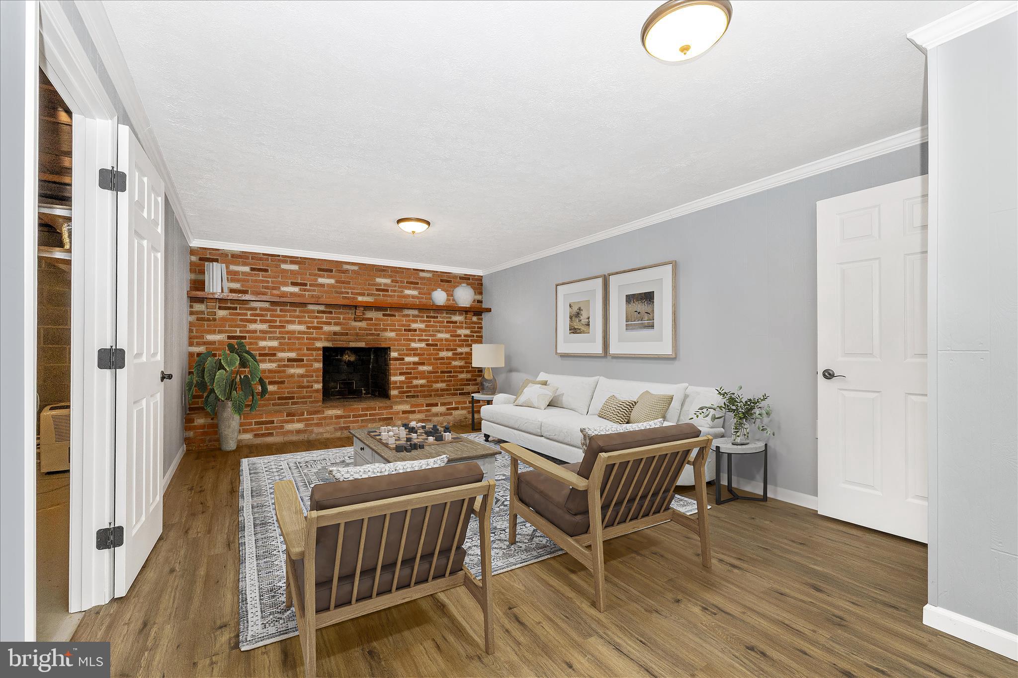 2640 Jefferson Pike Jefferson, MD 21755 - Photo 28 of 63 a living room with furniture a fireplace and a flat screen tv
