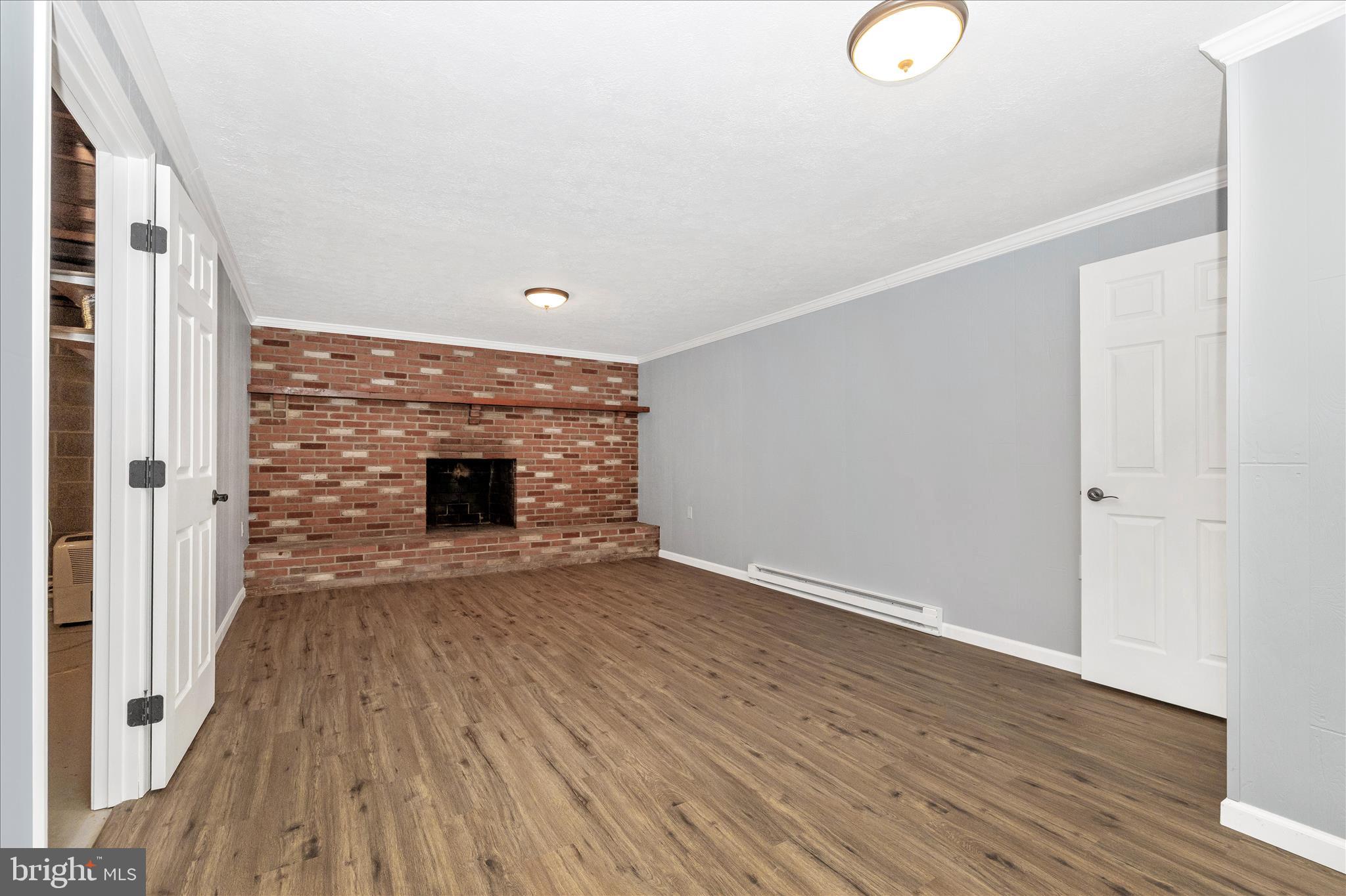 2640 Jefferson Pike Jefferson, MD 21755 - Photo 29 of 63 a view of an empty room with wooden floor and a window