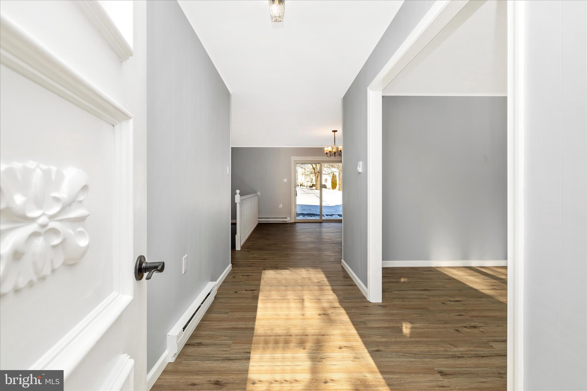 2640 Jefferson Pike Jefferson, MD 21755 - Photo 3 of 63 a view of a hallway with wooden floor and staircase