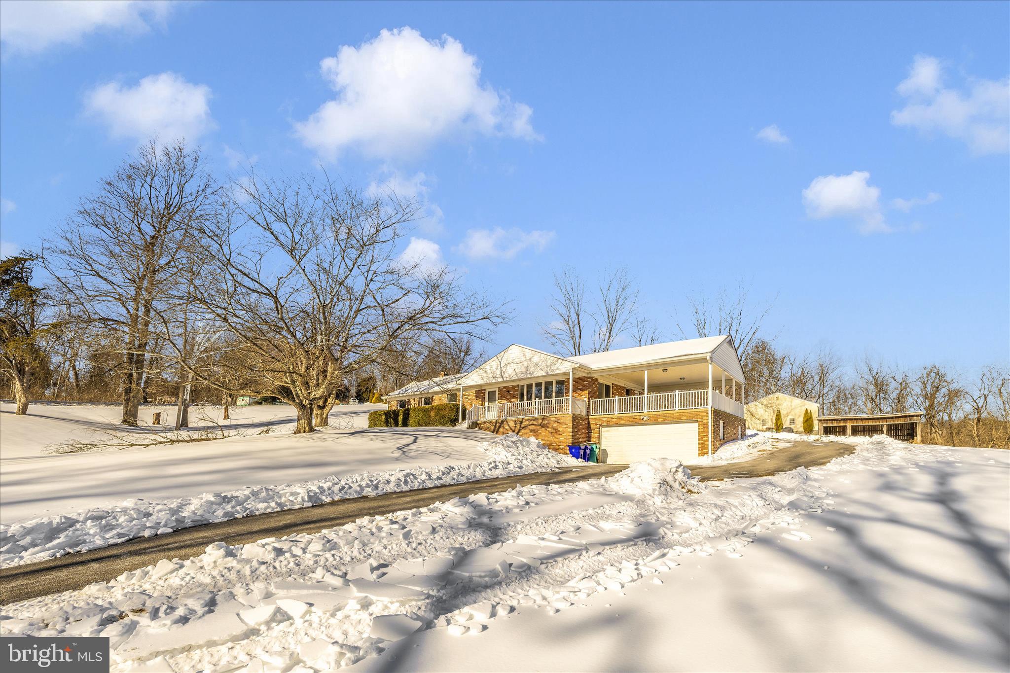 2640 Jefferson Pike Jefferson, MD 21755 - Photo 47 of 63 a view of a white house with a yard covered in snow