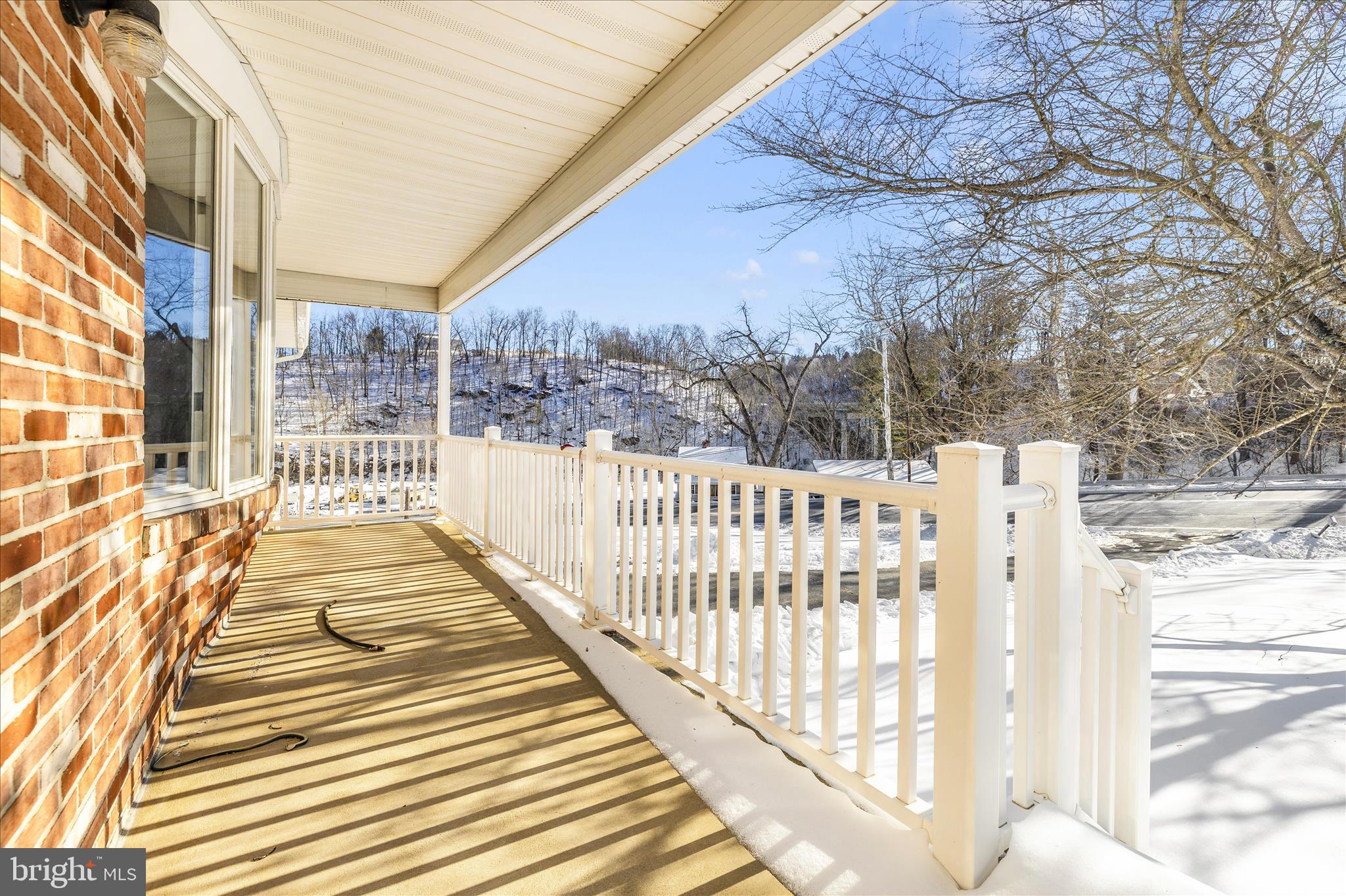 2640 Jefferson Pike Jefferson, MD 21755 - Photo 48 of 63 a view of a balcony with wooden floor and fence
