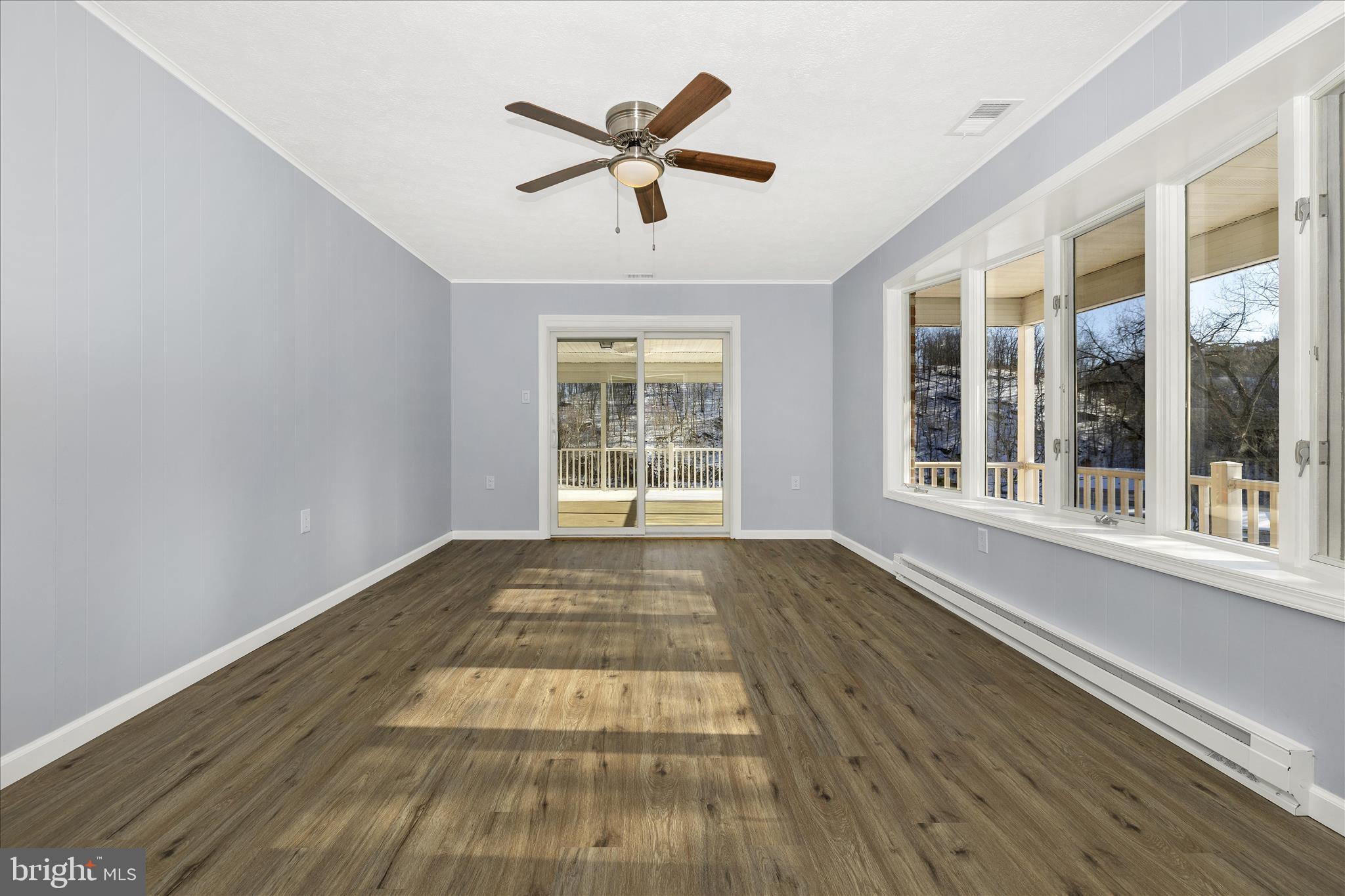 2640 Jefferson Pike Jefferson, MD 21755 - Photo 5 of 63 a view of an empty room with wooden floor and a window
