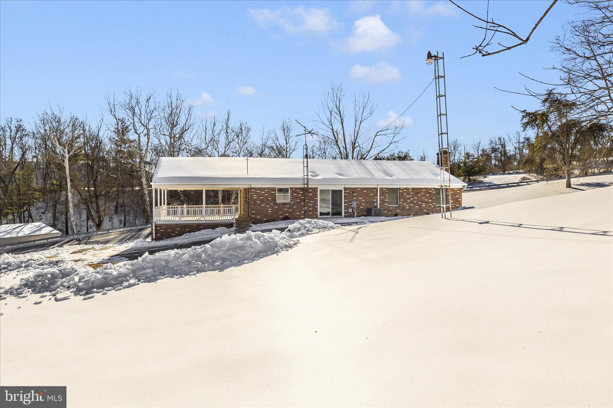 2640 Jefferson Pike Jefferson, MD 21755 - Photo 55 of 63 a front view of a house with a yard and trees