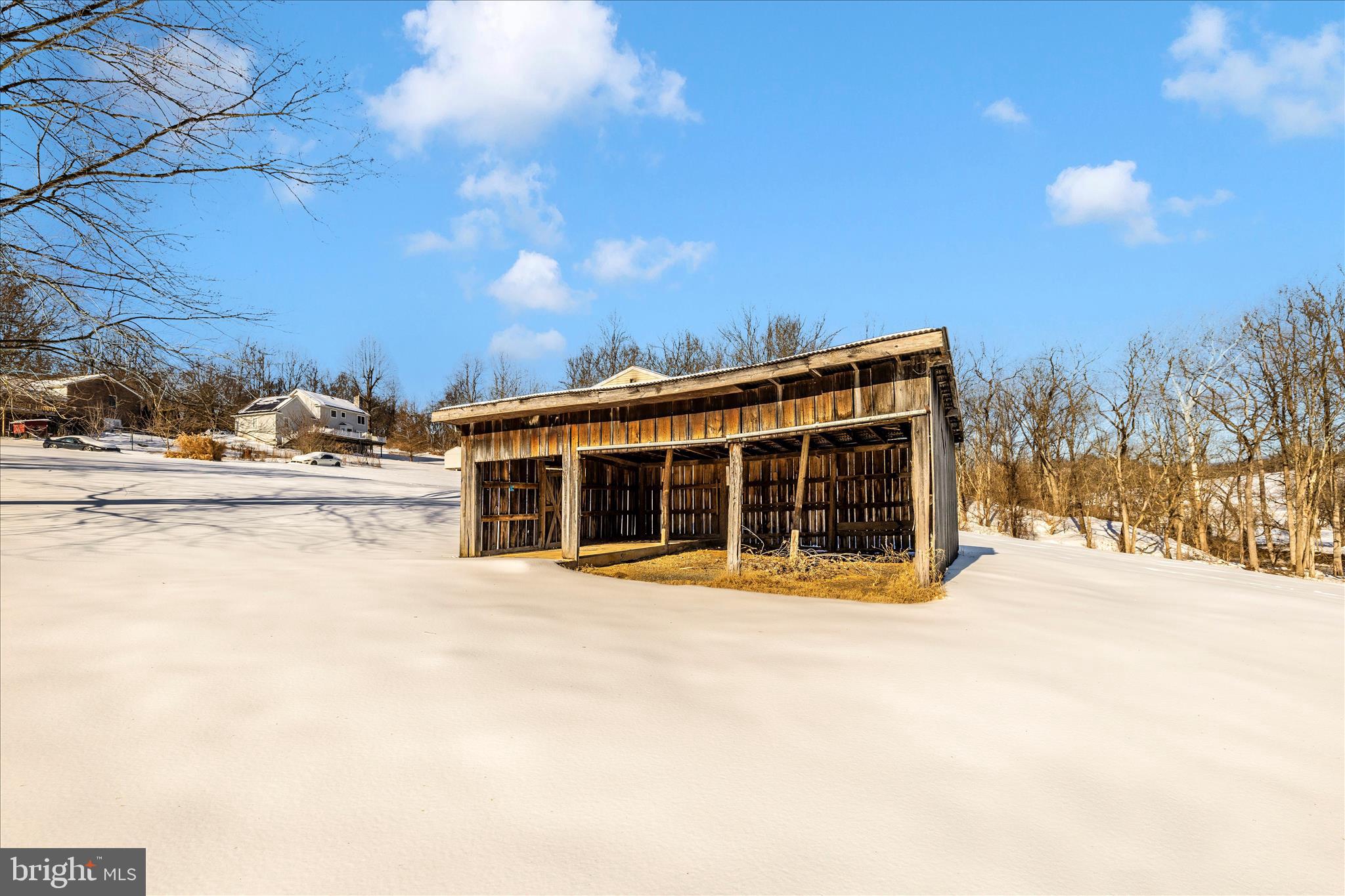 2640 Jefferson Pike Jefferson, MD 21755 - Photo 62 of 63 a view of a house with a yard and covered with snow