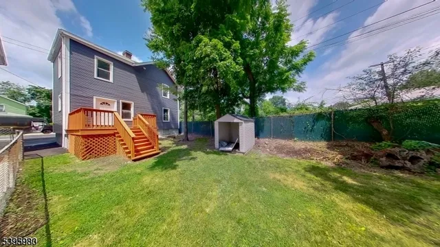 a view of a chairs in a backyard